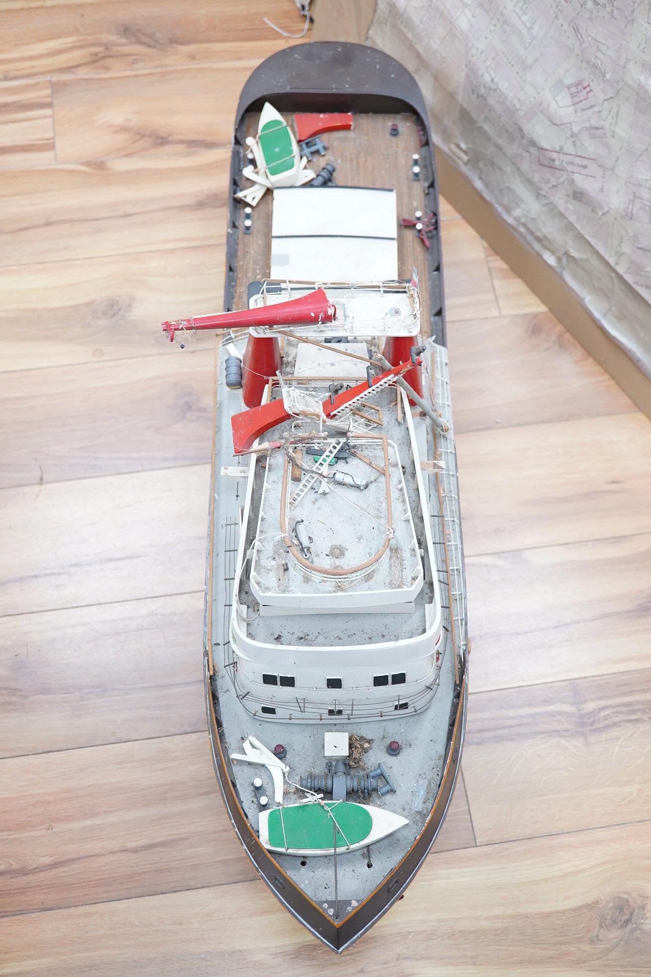 A model of the tugboat Amsterdam, probably built from a kit as a pond yacht, and powered by an electric motor, length of hull approx 103cm, of primarily painted wood construction